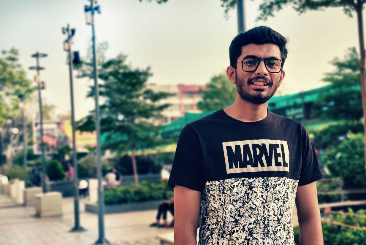 A younger Saharsh wearing a Marvel T-shirt outdoors, from the original portfolio