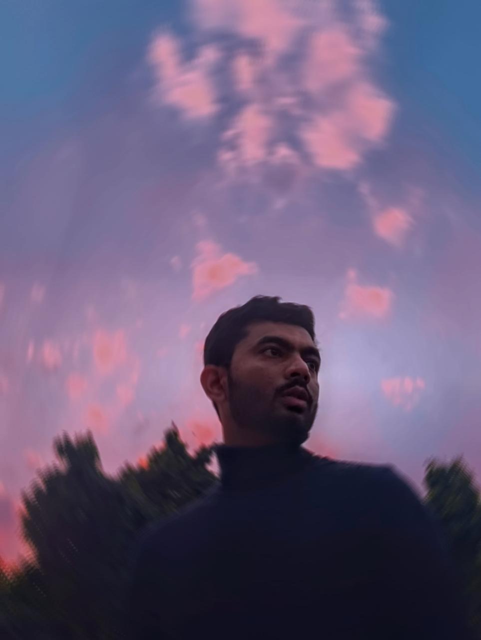 Saharsh beneath a blue and pink evening sky